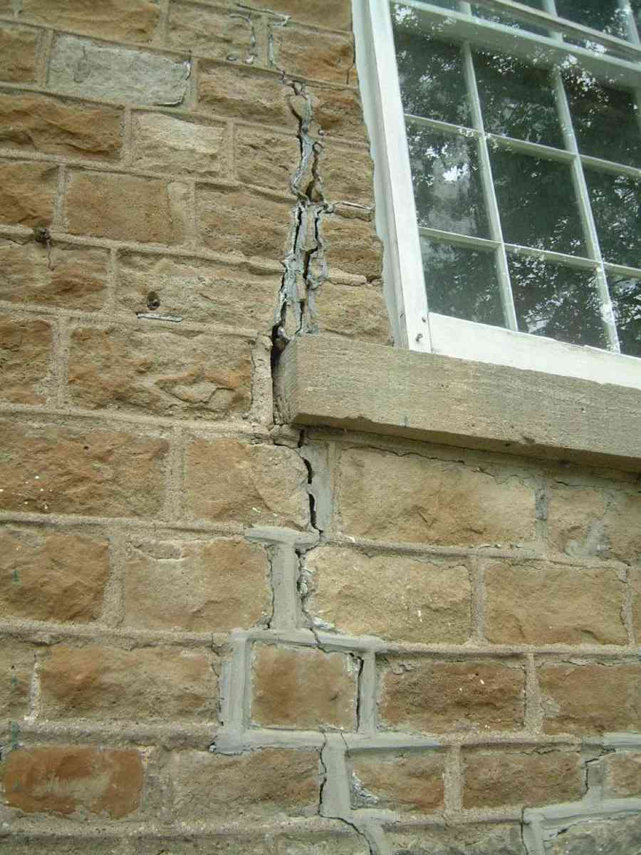 Stair-step crack in a masonry brick wall