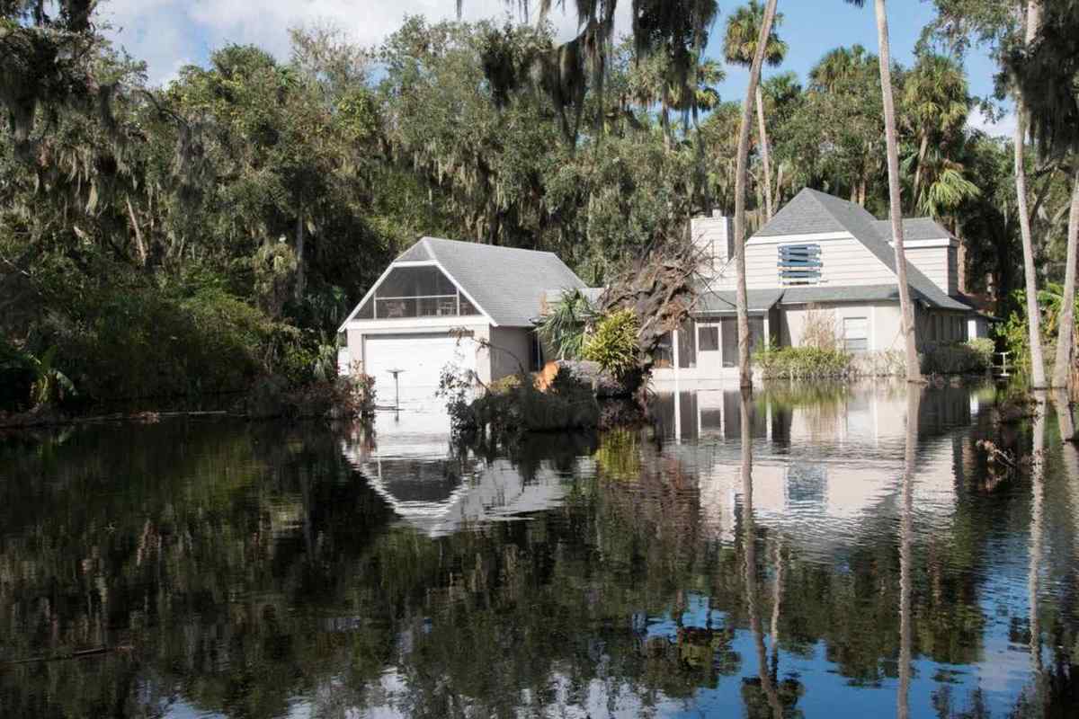 Rain floodwater pooling around a home's foundation