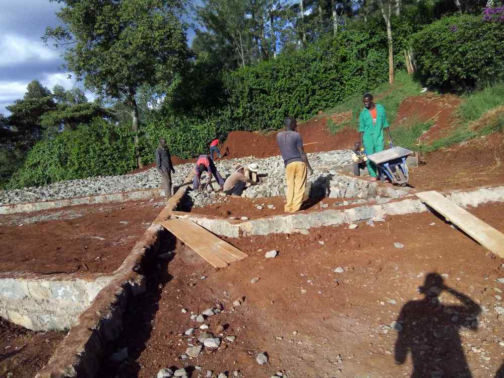 Workers building a foundation footing on a construction site
